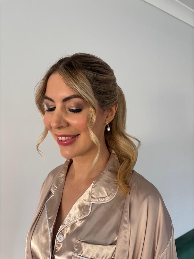Soft bridal updo with face-framing pieces