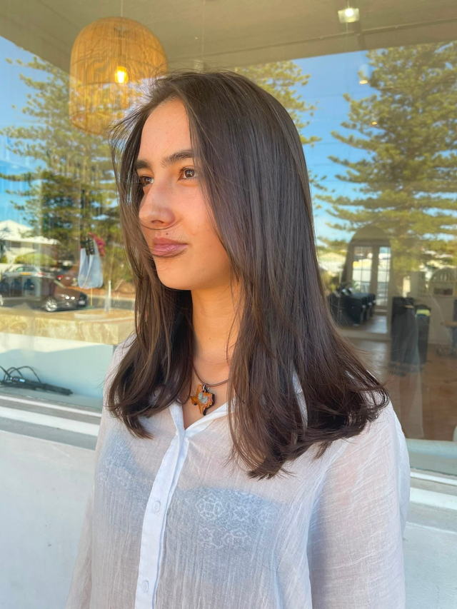 Glossy chocolate brunette with a blunt mid-length cut