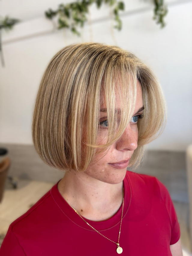 Blonde chin-length bob with soft face-framing pieces