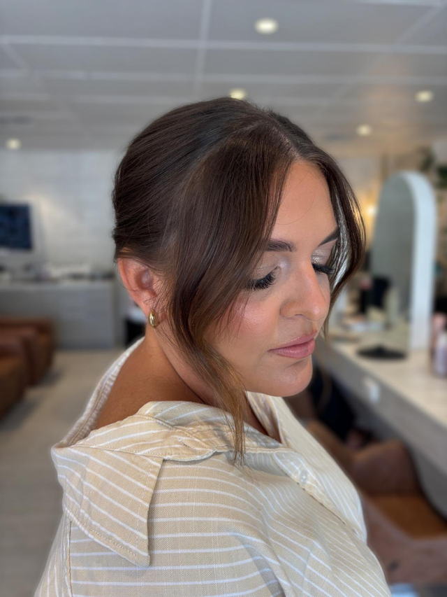 Brunette upstyle with soft face-framing tendrils