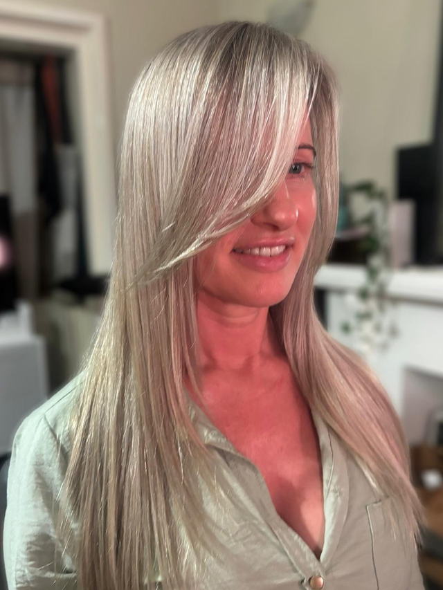 Icy pearl blonde with long sleek layers