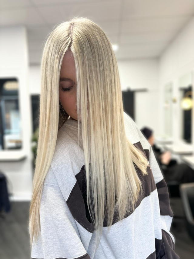 Platinum blonde extensions with a poker-straight finish