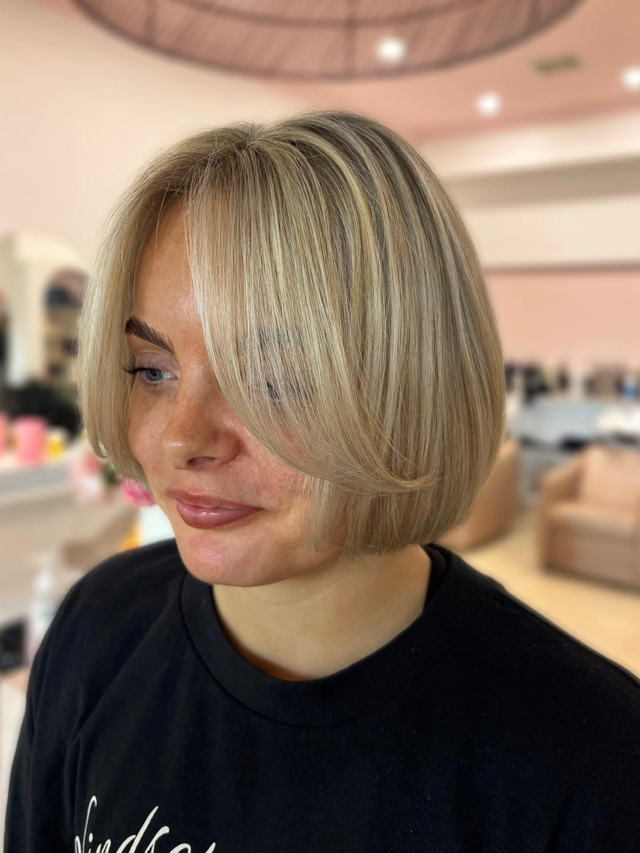 Cool blonde chin-length bob with soft bend