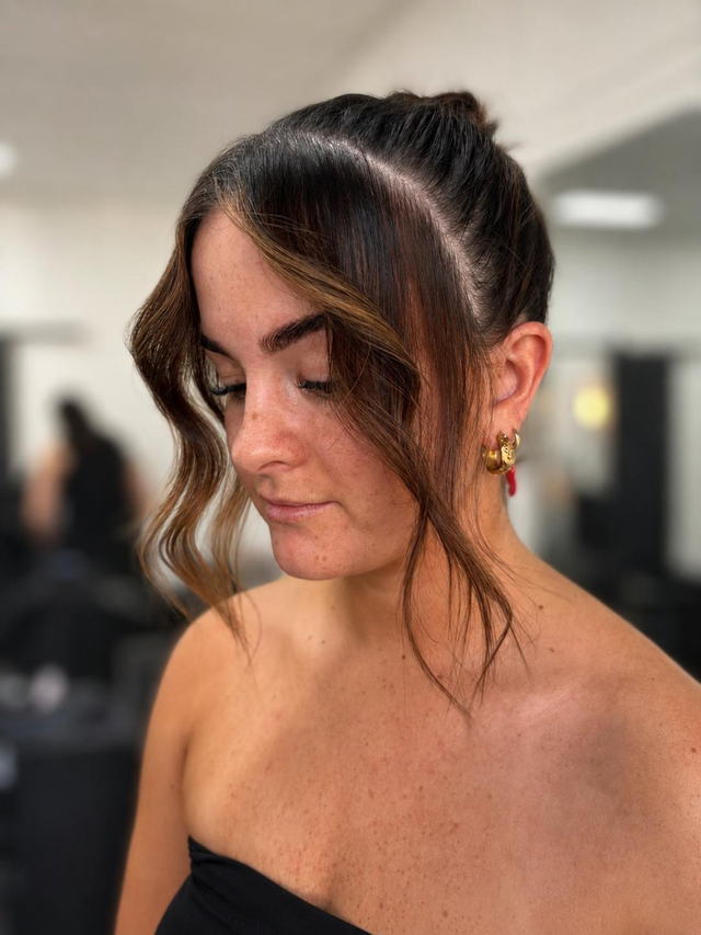 Brunette updo with soft face-framing waves