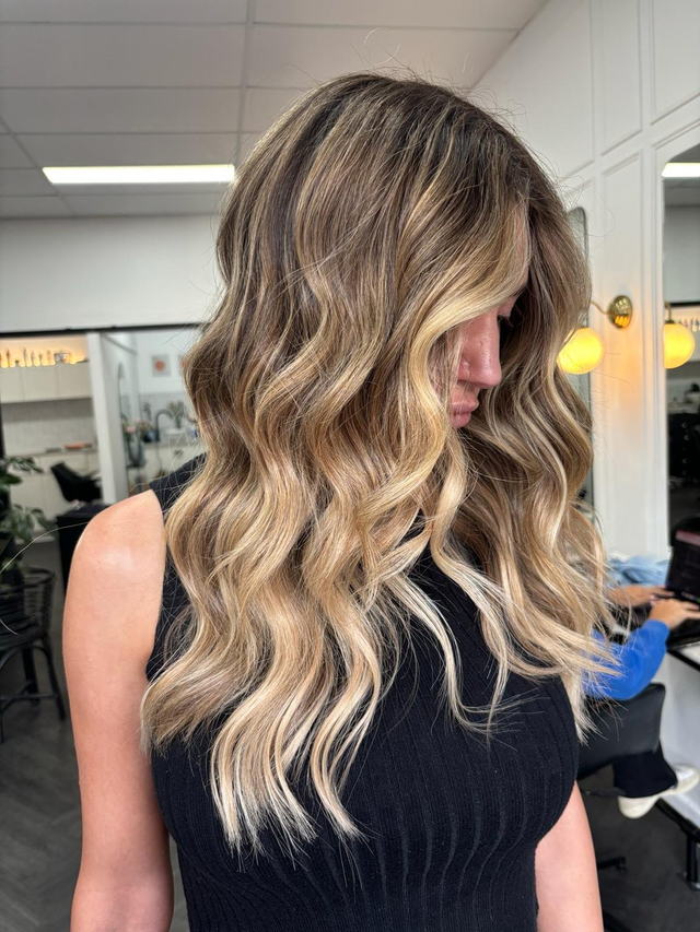 Blonde balayage with lived-in beachy waves