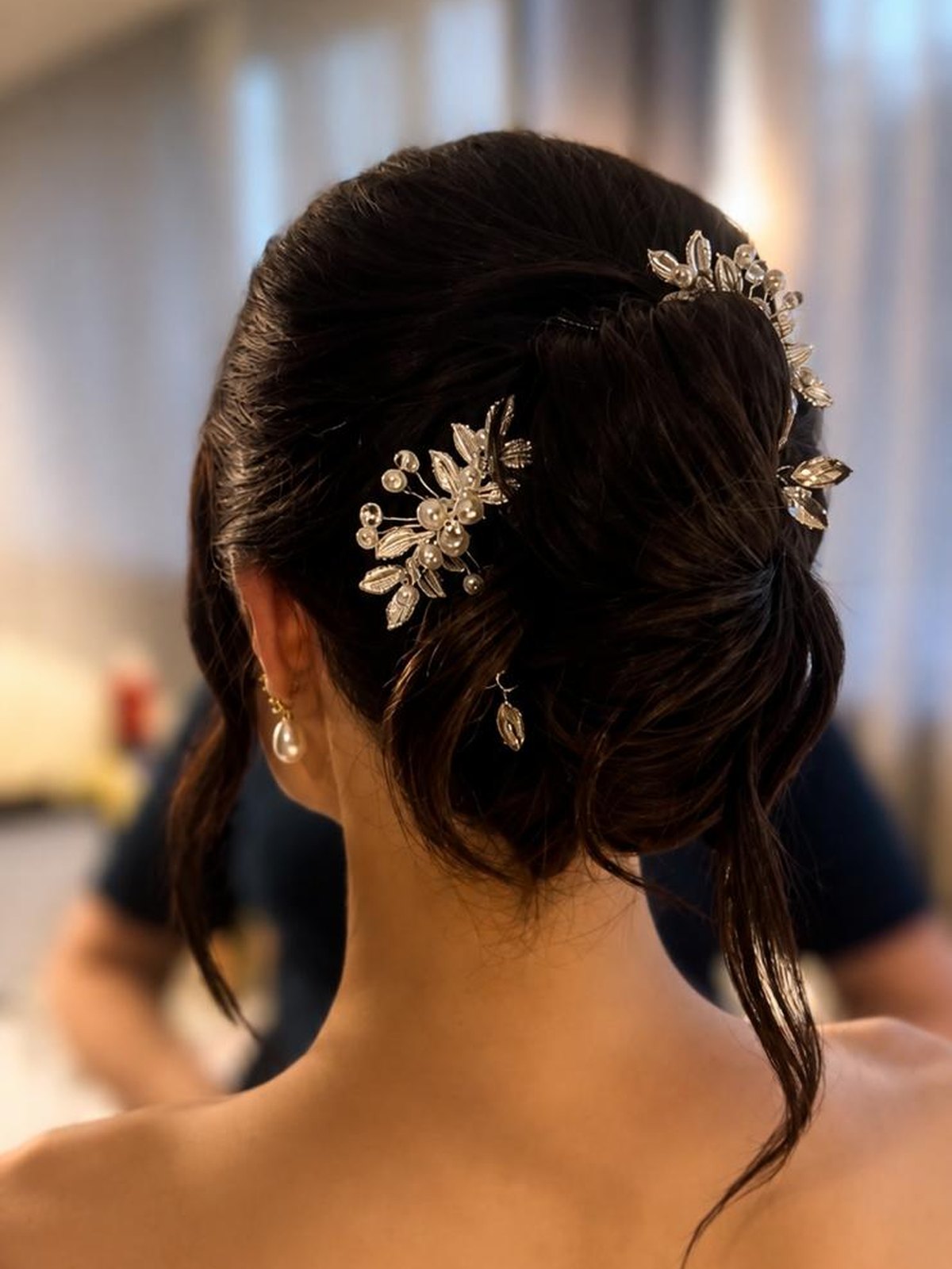 Bridal updo with pearl hair vine